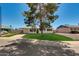 Charming home featuring a well-maintained lawn and a welcoming facade under a clear, sunny sky at 7507 E Beatrice St, Scottsdale, AZ 85257