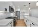 Bright kitchen with stainless steel appliances, ample counter space, and stylish pendant lighting at 7507 E Beatrice St, Scottsdale, AZ 85257