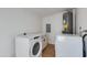 Modern laundry room featuring new washer, dryer, and granite countertop at 7507 E Beatrice St, Scottsdale, AZ 85257