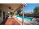 Backyard area features a refreshing in-ground pool and patio furniture for outdoor living at 843 W Palo Verde St, Gilbert, AZ 85233