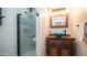 Stylish bathroom featuring a unique vessel sink and vanity with a glass-enclosed shower at 843 W Palo Verde St, Gilbert, AZ 85233