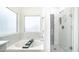 Beautiful bathroom features a tub and shower with elegant marble tile at 843 W Palo Verde St, Gilbert, AZ 85233