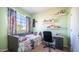 Cozy bedroom with a twin bed, neutral carpeting, and bright, light green walls at 843 W Palo Verde St, Gilbert, AZ 85233
