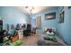 A bedroom with blue walls, a work desk, and a single bed at 843 W Palo Verde St, Gilbert, AZ 85233