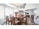 Elegant dining area with large table, stylish chandelier, and view of the living space at 843 W Palo Verde St, Gilbert, AZ 85233