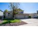 Charming two-story home featuring a three-car garage, landscaped yard, and a welcoming entrance at 843 W Palo Verde St, Gilbert, AZ 85233