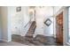 Welcoming foyer with hardwood floors, staircase, and ample natural light, creating an inviting atmosphere at 843 W Palo Verde St, Gilbert, AZ 85233