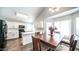 Bright kitchen with white cabinets, modern appliances, and adjacent dining area, perfect for gatherings at 843 W Palo Verde St, Gilbert, AZ 85233