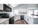 Well-lit kitchen featuring white cabinetry, modern countertops, and updated appliances at 843 W Palo Verde St, Gilbert, AZ 85233