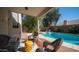Inviting covered patio with comfortable seating overlooking a sparkling pool at 843 W Palo Verde St, Gilbert, AZ 85233