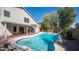 Beautiful backyard pool with clear blue water, privacy landscaping, and covered patio at 843 W Palo Verde St, Gilbert, AZ 85233