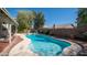 Sparkling backyard pool surrounded by lush landscaping, brick accents, and patio perfect for relaxing at 843 W Palo Verde St, Gilbert, AZ 85233