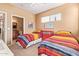 Comfortable bedroom with two twin beds, carpet, and natural light from a window at 9070 E Gary Rd # 136, Scottsdale, AZ 85260