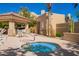Relaxing community hot tub area with seating, a grill, and desert landscaping, perfect for social gatherings at 9070 E Gary Rd # 136, Scottsdale, AZ 85260