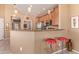 Breakfast bar kitchen with stainless steel appliances and granite countertops at 9070 E Gary Rd # 136, Scottsdale, AZ 85260
