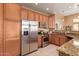 Well-equipped kitchen with stainless steel appliances, granite counters, and wooden cabinetry at 9070 E Gary Rd # 136, Scottsdale, AZ 85260