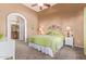 Cozy main bedroom with plush carpet, ceiling fan and access to the en-suite bathroom at 9070 E Gary Rd # 136, Scottsdale, AZ 85260