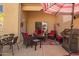 Cozy outdoor patio with comfortable seating, a grill, and a striped umbrella for shade at 9070 E Gary Rd # 136, Scottsdale, AZ 85260