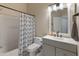 Well-lit bathroom featuring a shower/tub combo and gray vanity with white countertop at 927 W Wendy Way, Gilbert, AZ 85233