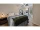 Cozy bedroom with neutral colors, carpet flooring, and a ceiling fan, showcasing a comfortable living space at 927 W Wendy Way, Gilbert, AZ 85233
