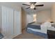 Inviting bedroom featuring a ceiling fan, carpet, and closet, creating a comfortable and functional space at 927 W Wendy Way, Gilbert, AZ 85233