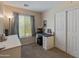 Bedroom featuring neutral tones, carpet, a window for natural light, and desk, perfect for relaxation at 927 W Wendy Way, Gilbert, AZ 85233