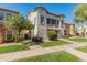 Charming two-story townhome with stucco exterior, a well-manicured lawn, and mature trees in a friendly neighborhood at 927 W Wendy Way, Gilbert, AZ 85233