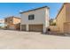 Exterior view of townhome with two car garage and additional parking at 927 W Wendy Way, Gilbert, AZ 85233