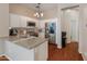 Bright kitchen featuring stainless steel appliances, granite countertops, white cabinets, and a modern island at 927 W Wendy Way, Gilbert, AZ 85233
