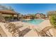 Community pool with lounge chairs and covered pavilion on a sunny day at 927 W Wendy Way, Gilbert, AZ 85233