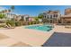 Community pool with lounge chairs and beautiful landscaping on a sunny day at 927 W Wendy Way, Gilbert, AZ 85233