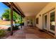 An outdoor patio with stone flooring and views of the pool and landscaping at 930 E Citation Ln, Tempe, AZ 85284