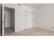 Bright bedroom with neutral walls, carpeting, and a double-door closet for plenty of storage at 930 E Citation Ln, Tempe, AZ 85284