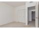 This is a spacious bedroom with carpet, white walls, and a double-door closet at 930 E Citation Ln, Tempe, AZ 85284