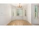 Cozy dining area with tile flooring, wainscoting, plantation shutters, and chandelier lighting at 930 E Citation Ln, Tempe, AZ 85284