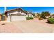Well-maintained single-story home featuring a tidy front yard, driveway and two-car garage at 930 E Citation Ln, Tempe, AZ 85284