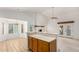 Open-concept living room featuring high ceilings, tile floors, a fireplace, and access to the backyard at 930 E Citation Ln, Tempe, AZ 85284