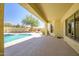 Backyard pool with stamped concrete patio and outdoor kitchen with grill at 12733 S 177Th Ln, Goodyear, AZ 85338