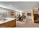 Spacious basement with a poker table, wet bar and adjacent staircase to the upper level at 12733 S 177Th Ln, Goodyear, AZ 85338