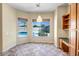 Bright breakfast nook featuring tile flooring and a large window overlooking the sparkling pool at 12733 S 177Th Ln, Goodyear, AZ 85338