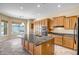 Kitchen featuring a central island, granite countertops, lots of cabinet space, and stainless steel appliances at 12733 S 177Th Ln, Goodyear, AZ 85338