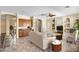 Open-concept living room with built-in cabinets, comfortable seating, and access to other rooms at 12733 S 177Th Ln, Goodyear, AZ 85338
