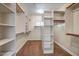 Well-organized walk-in closet with ample shelving and hanging space to store all your clothing and accessories at 12733 S 177Th Ln, Goodyear, AZ 85338