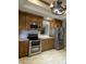 Kitchen with stainless steel appliances, wooden cabinets, and granite countertops at 19322 E Calle De Flores --, Queen Creek, AZ 85142