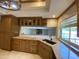 Kitchen featuring wooden cabinets, granite countertops, and undermount sink at 19322 E Calle De Flores --, Queen Creek, AZ 85142
