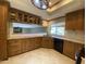 Kitchen with wood cabinetry, undermount sink, and stainless steel appliances at 19322 E Calle De Flores --, Queen Creek, AZ 85142