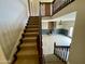 View of the living room with carpeted stairs and stone fireplace at 19322 E Calle De Flores --, Queen Creek, AZ 85142