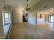 Spacious living room with tiled flooring, unique lighting, and window seating at 19322 E Calle De Flores --, Queen Creek, AZ 85142