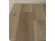 Close-up of new hardwood flooring featuring light brown tones and a natural wood grain pattern at 3871 E Ironhorse Rd, Gilbert, AZ 85297