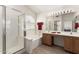 Bathroom with a walk-in shower, a tub, and a dual-sink vanity with ample counter space at 10322 E Excavation Ct, Gold Canyon, AZ 85118